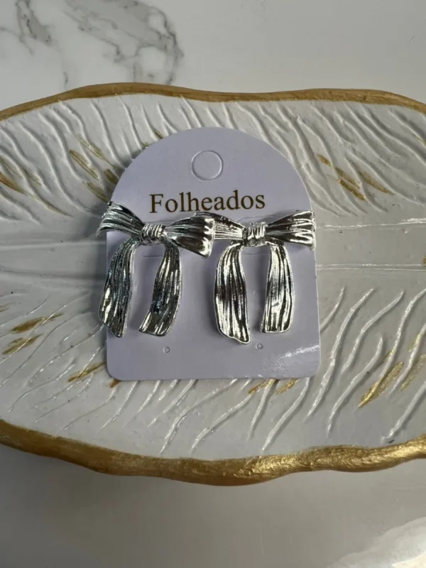Moñitos con colca larga plateado