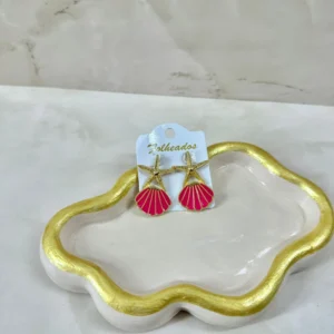 Estrella de mar con concha fuscia
